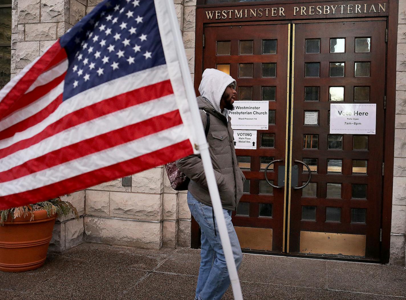 A pedestrian outside the polling place at Westminster Presbyterian Church in Minneapolis.