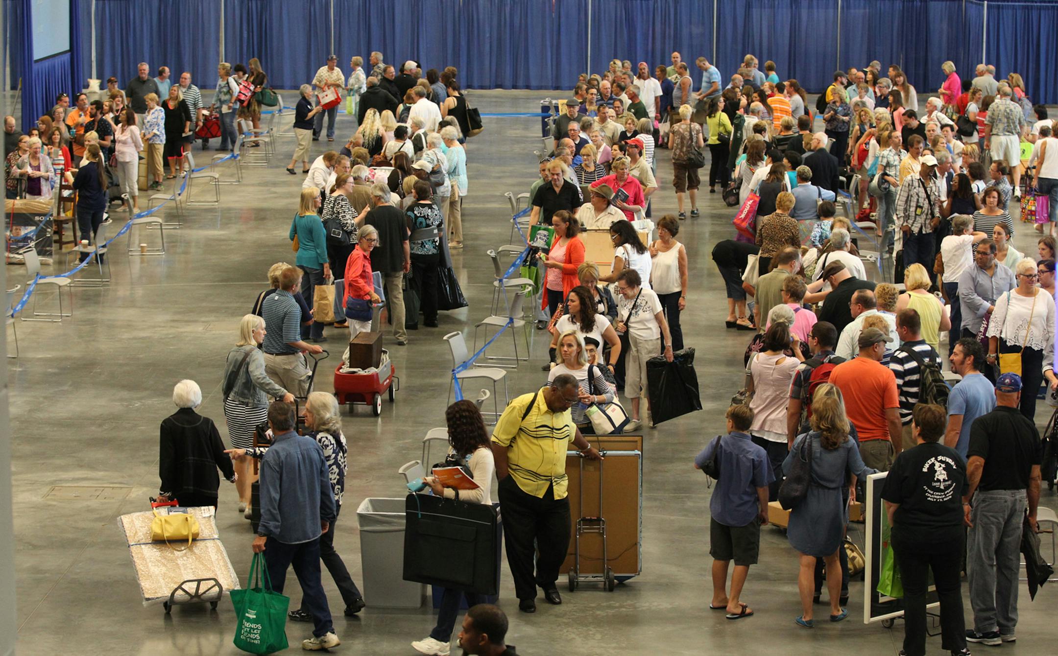 Hopeful ticket holders wait in line at the Cleveland Convention Center to have their items appraised at the Antiques Roadshow 2015 summer tour in Cleveland, Ohio, on Saturday, July 11, 2015. (Mike Cardew/Akron Beacon Journal/TNS)