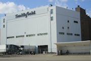 Smithfield said it will close its giant pork processing plant in Sioux Falls, S.D., shown in a photo taken Wednesday, where health officials reported 