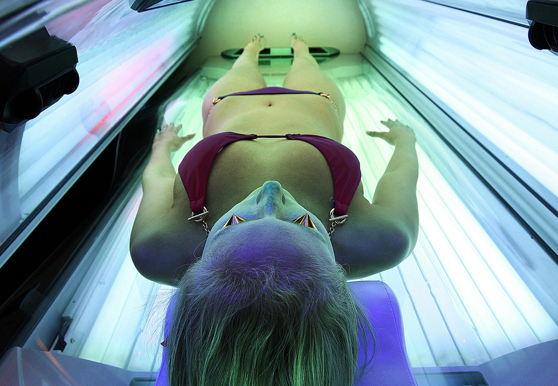 Erika Greet, an employee of U-Tan, a tanning salon located near the University of Southen California in Los Angeles, California, demonstrates the workings of an Ergoline Excellence tanning bed. With the new year comes a new 10 percent tax on tanning beds using UV rays. (Robert Gauthier/Los Angeles Times/MCT) ORG XMIT: MIN2013011112380134 ORG XMIT: MIN1401141749222121