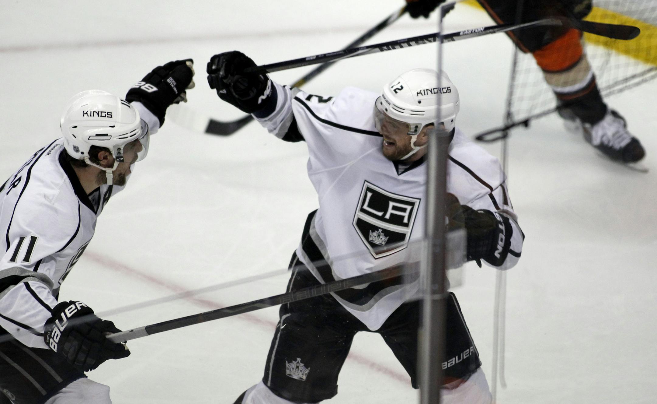 Los Angeles Kings right wing Marian Gaborik, right, celebrates his goal with center Anze Kopitar (11), of Slovenia, to defeat the Anaheim Ducks during overtime in Game 1 of an NHL hockey second-round Stanley Cup playoff series in Anaheim, Calif., Saturday, May 3, 2014. Kings won 3-2 in the overtime. (AP Photo/Alex Gallardo)