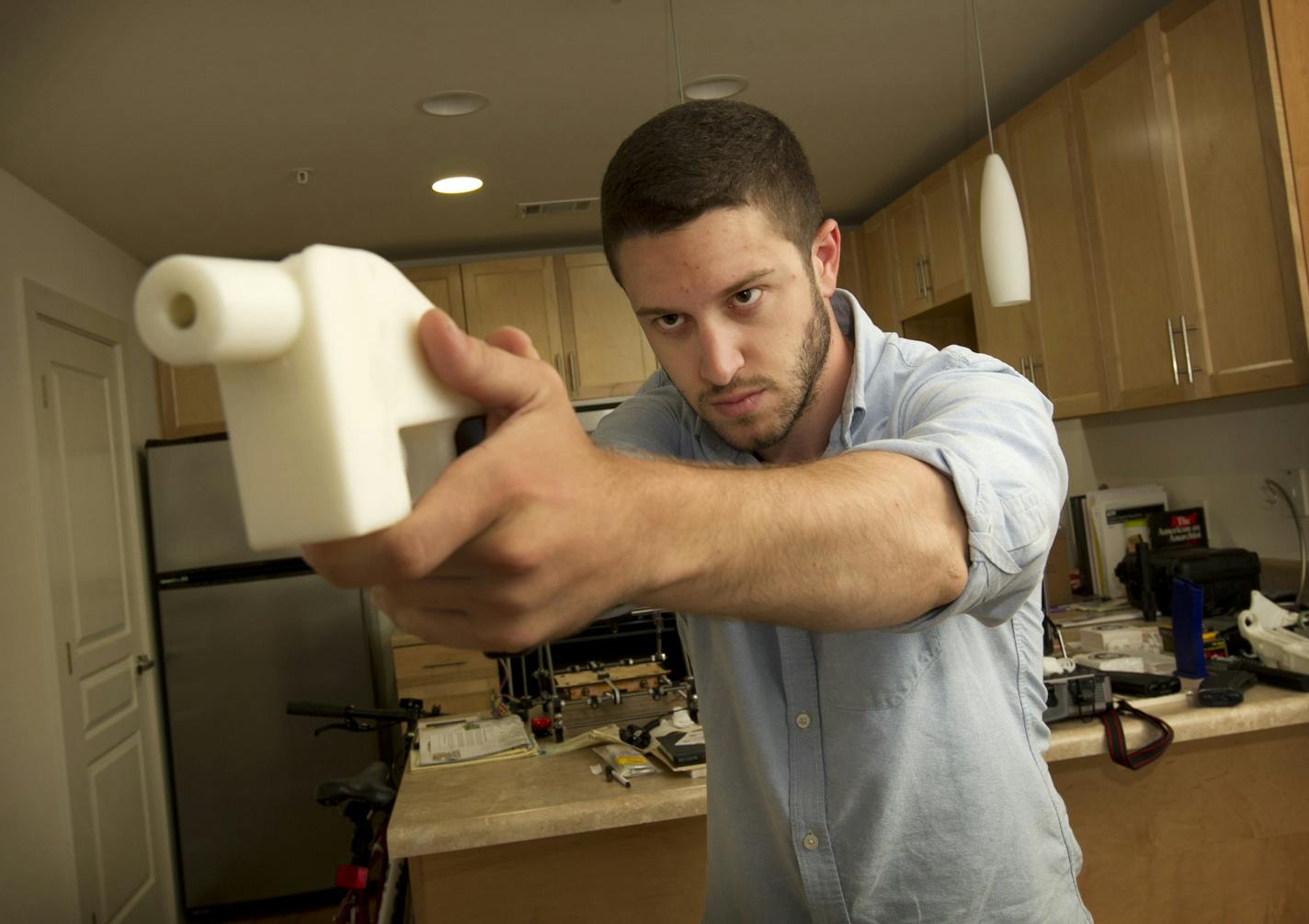 Cody Wilson shows the first completely 3D-printed handgun, The Liberator, at his home in Austin, Texas on Friday May 10, 2013. (Jay Janner/Austin American-State/TNS)