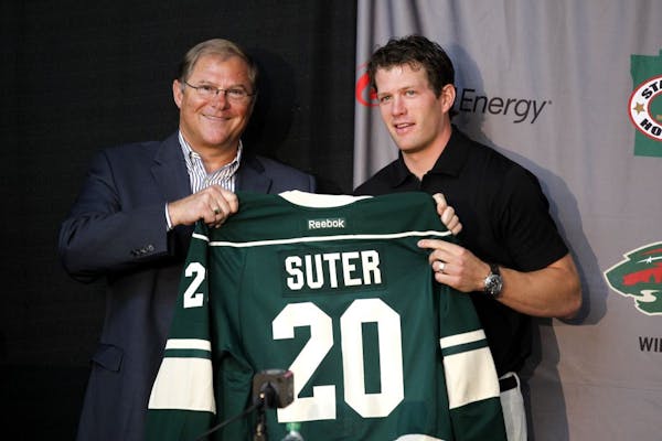 Wild owner Craig Leipold and new defenseman Ryan Suter at Monday's news conference at Xcel Energy Center.