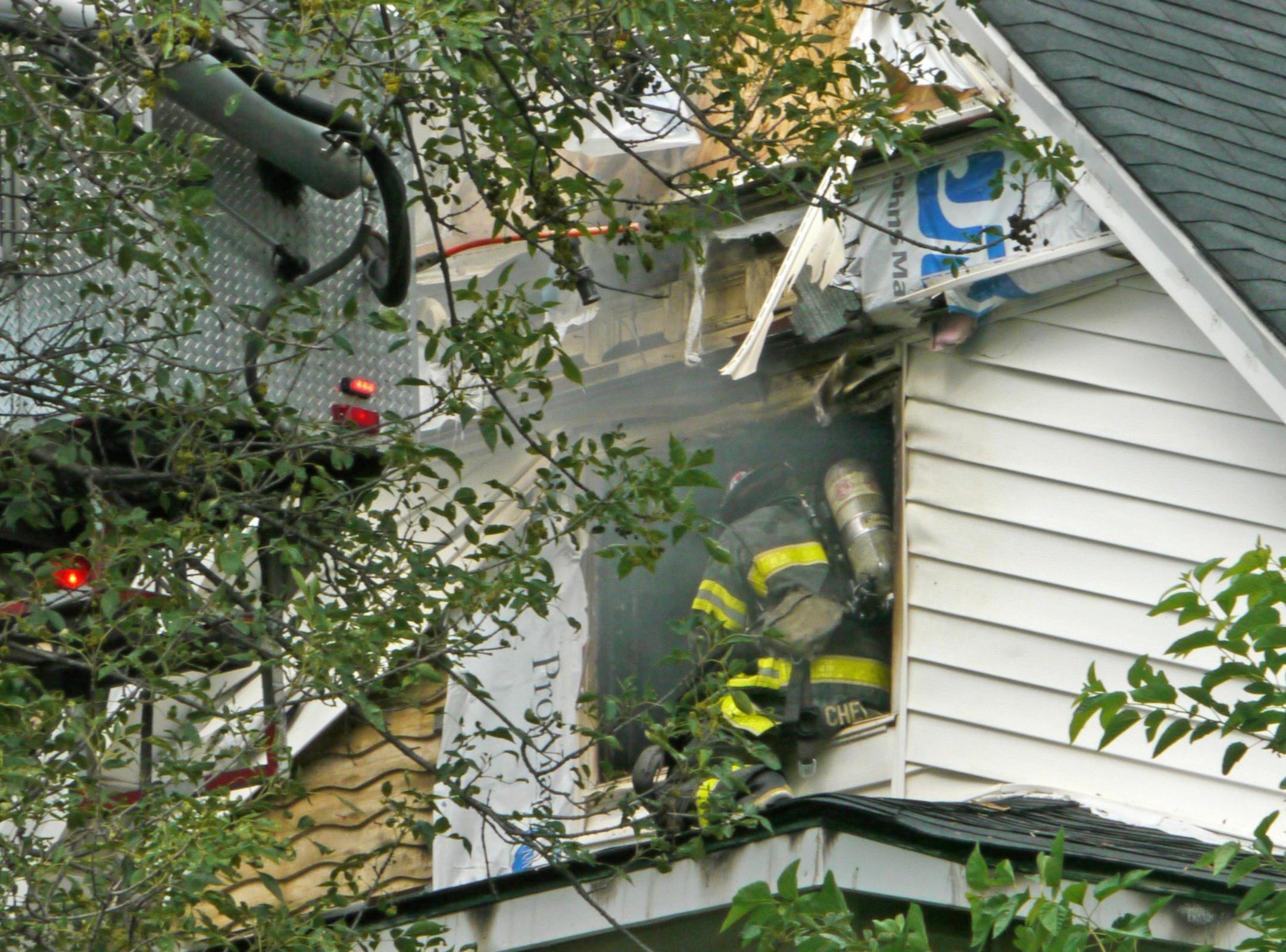 Firefighters worked in short shifts on a blazing, steamy day as they fought a duplex fire at 2321 Fillmore Av. NE. in Minneapolis Sunday afternoon.