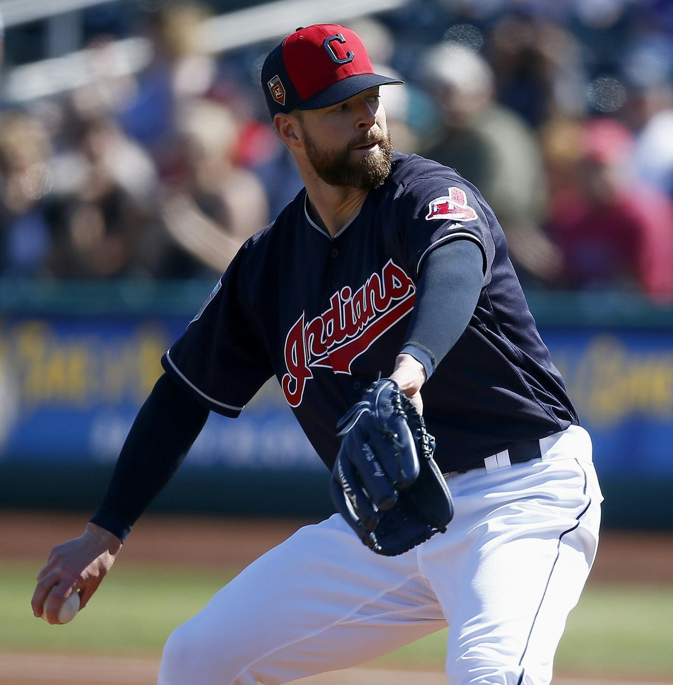 Cleveland Indians starting pitcher Corey Kluber throws a pitch against the Oakland Athletics during the first inning of a spring training baseball game Tuesday, Feb. 27, 2018, in Goodyear, Ariz. The Indians defeated the Athletics 16-8. (AP Photo/Ross D. Franklin)