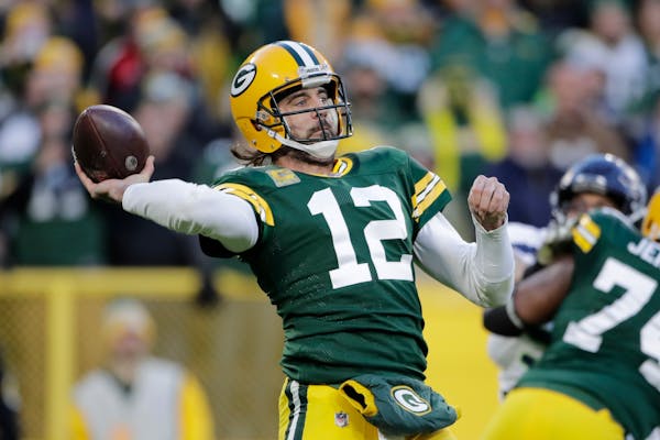 Aaron Rodgers was 23 of 37 for 292 yards and an interception against Seattle on Sunday in his return from COVID-19.