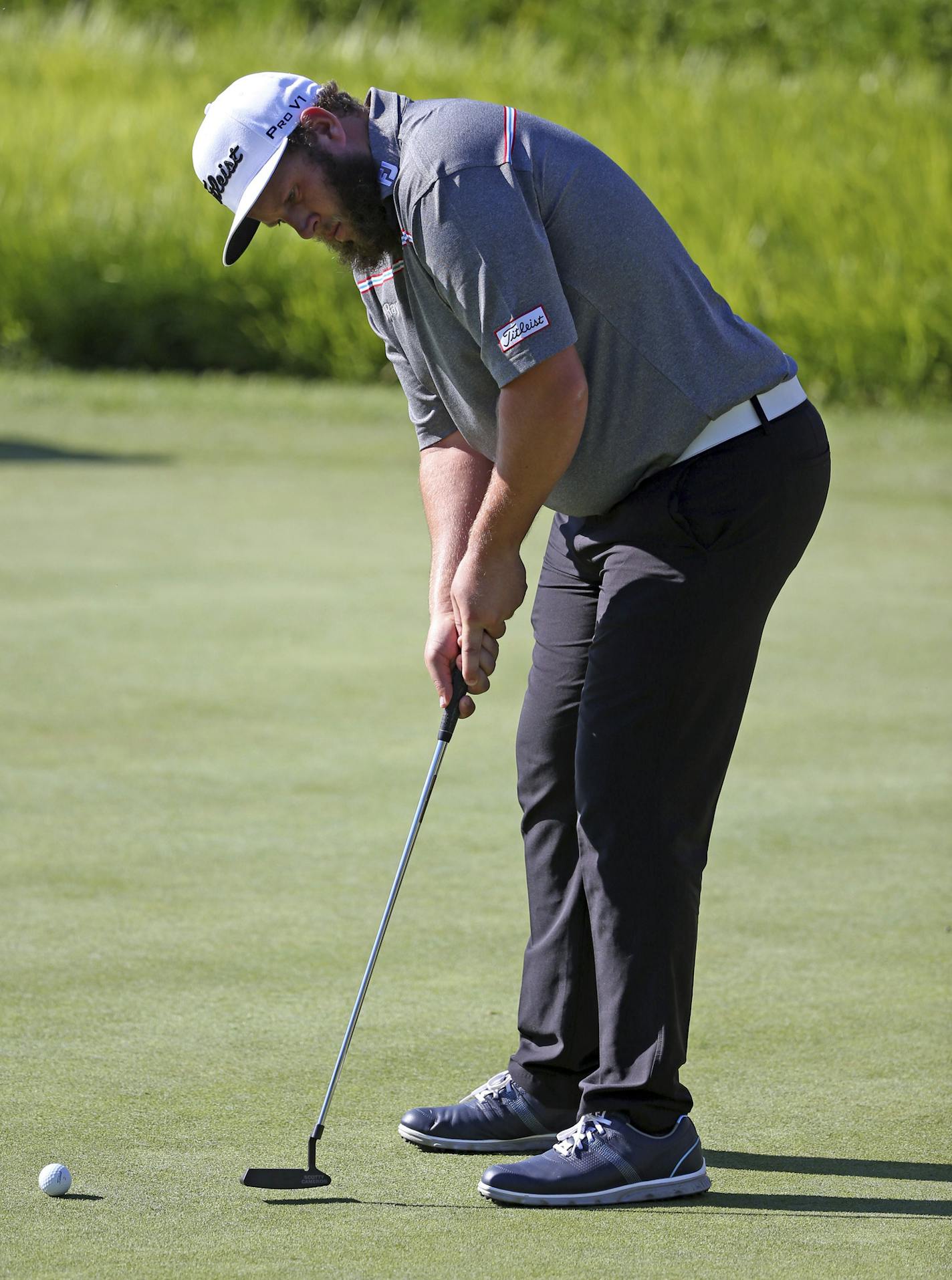 Andrew Johnston, of England, putts on the practice green before a practice round for the PGA Championship golf tournament at Baltusrol Golf Club in Springfield, N.J., Wednesday, July 27, 2016. (AP Photo/Seth Wenig)