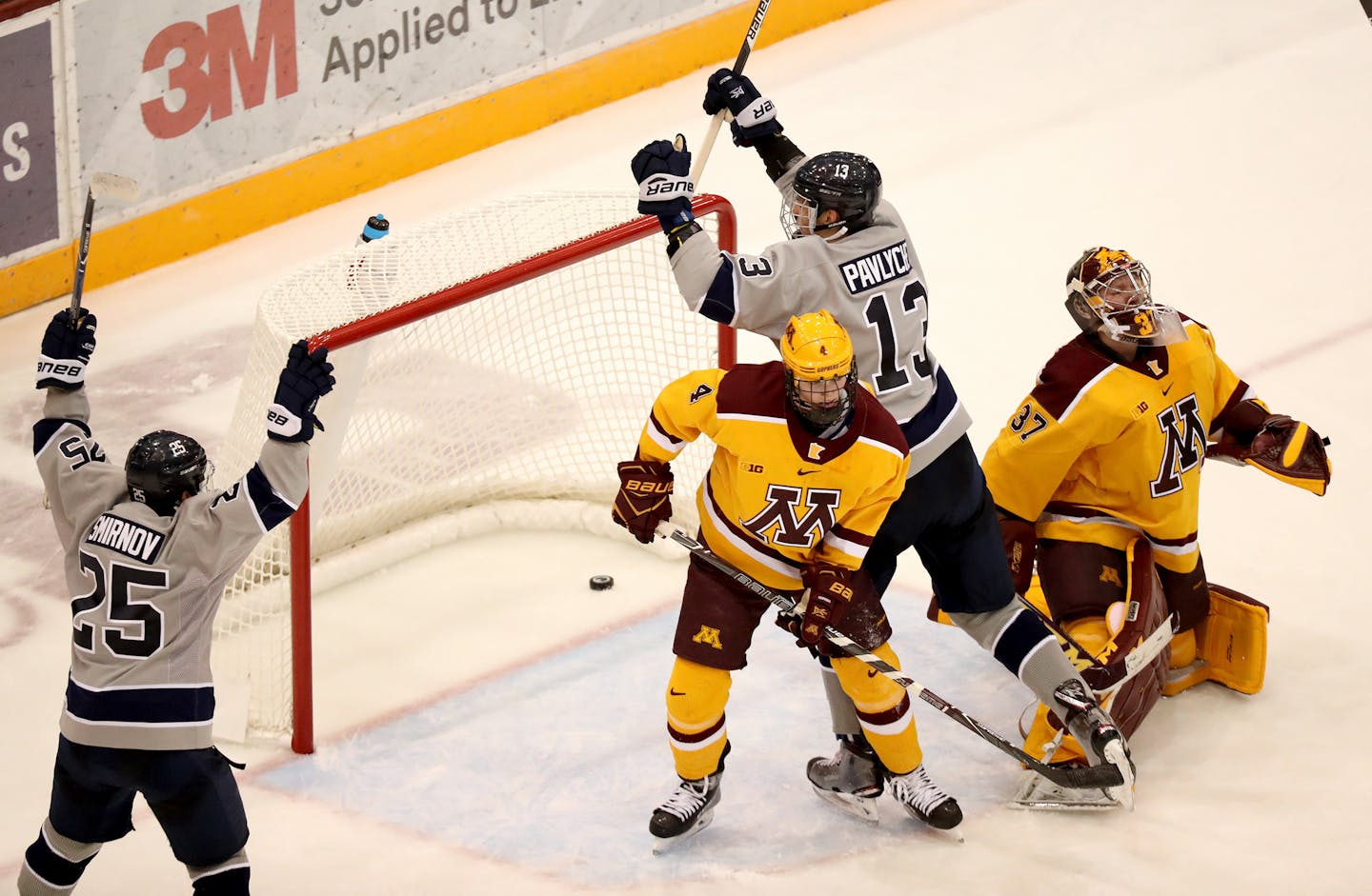 Penn State's Nikita Pavlychev (13) celebrates his second-period goal past Minnesota goalie Eric Schierhorn