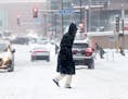 A pedestrians makes his way across Third Ave. S.in the snow Tuesday, Feb. 12, 2019, in Minneapolis, MN.] DAVID JOLES &#x2022;david.joles@startribune.c