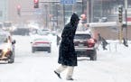 A pedestrians makes his way across Third Ave. S.in the snow Tuesday, Feb. 12, 2019, in Minneapolis, MN.] DAVID JOLES &#x2022;david.joles@startribune.c