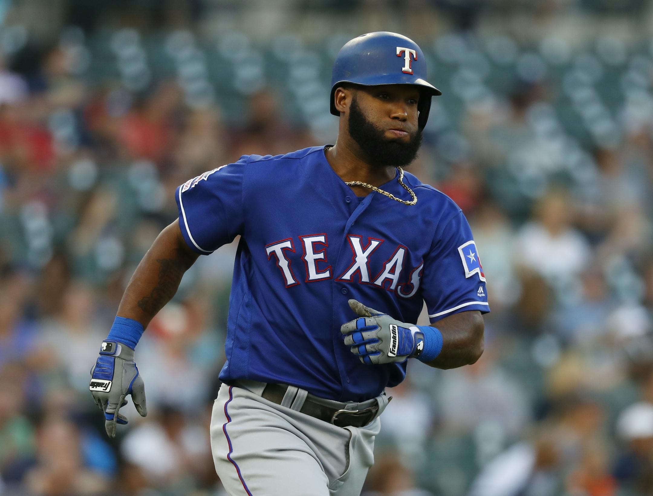 Texas Rangers' Danny Santana rounds first base after hitting a solo home run in the fifth inning of a baseball game against the Detroit Tigers in Detroit, Wednesday, June 26, 2019. (AP Photo/Paul Sancya)