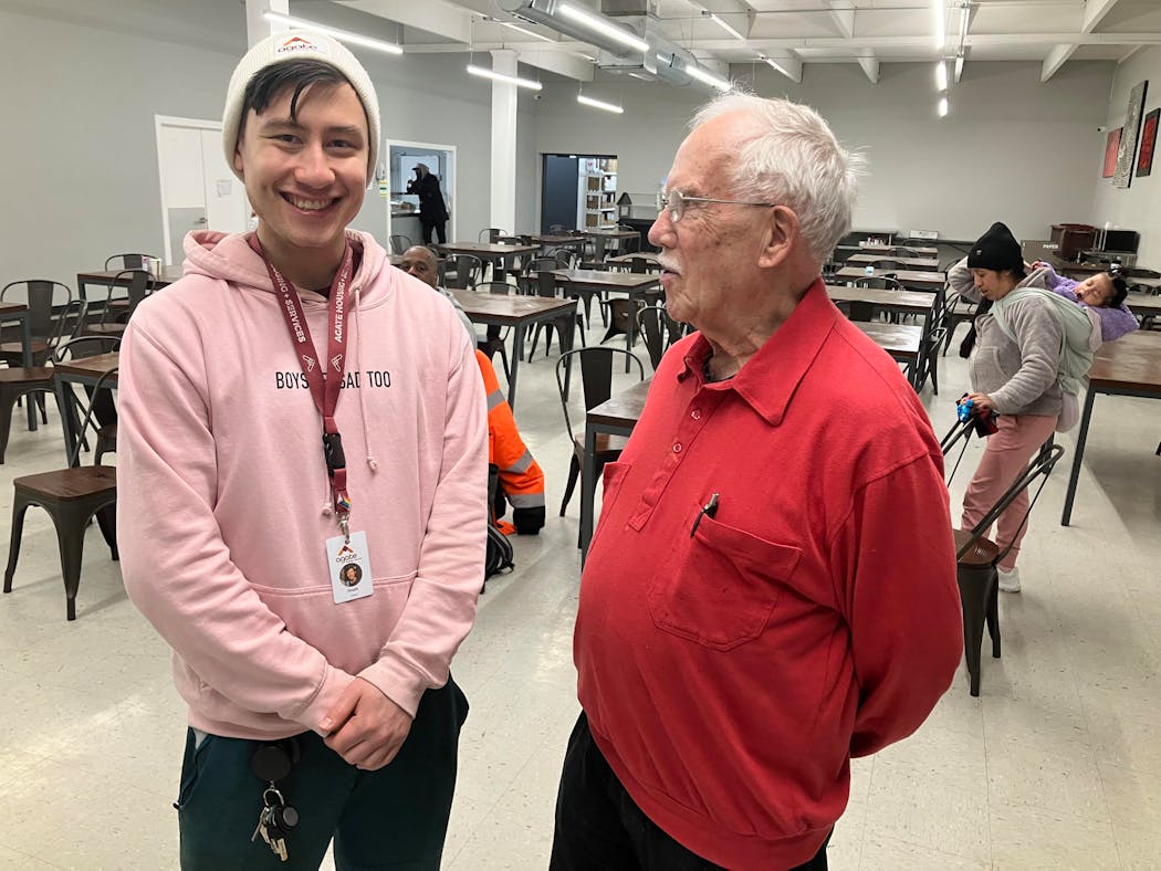 Noah Chan, left, Agate director of volunteer services, and Ted Pouliot chatted after a breakfast shift at House of Charity.