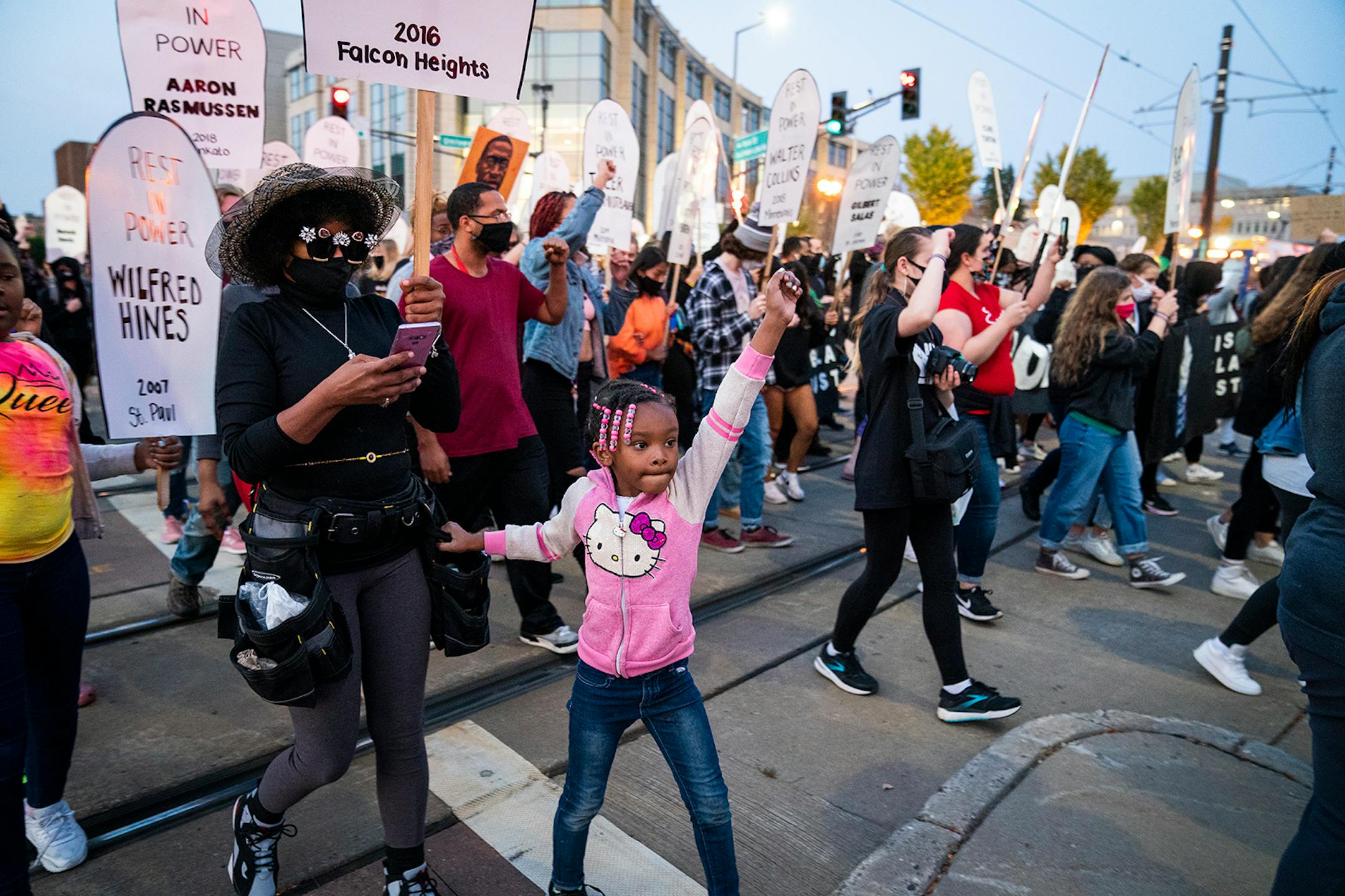 Families of those killed by police marched with hundreds of supporters in "The Secret March" down University Avenue to the Capitol in St. Paul.