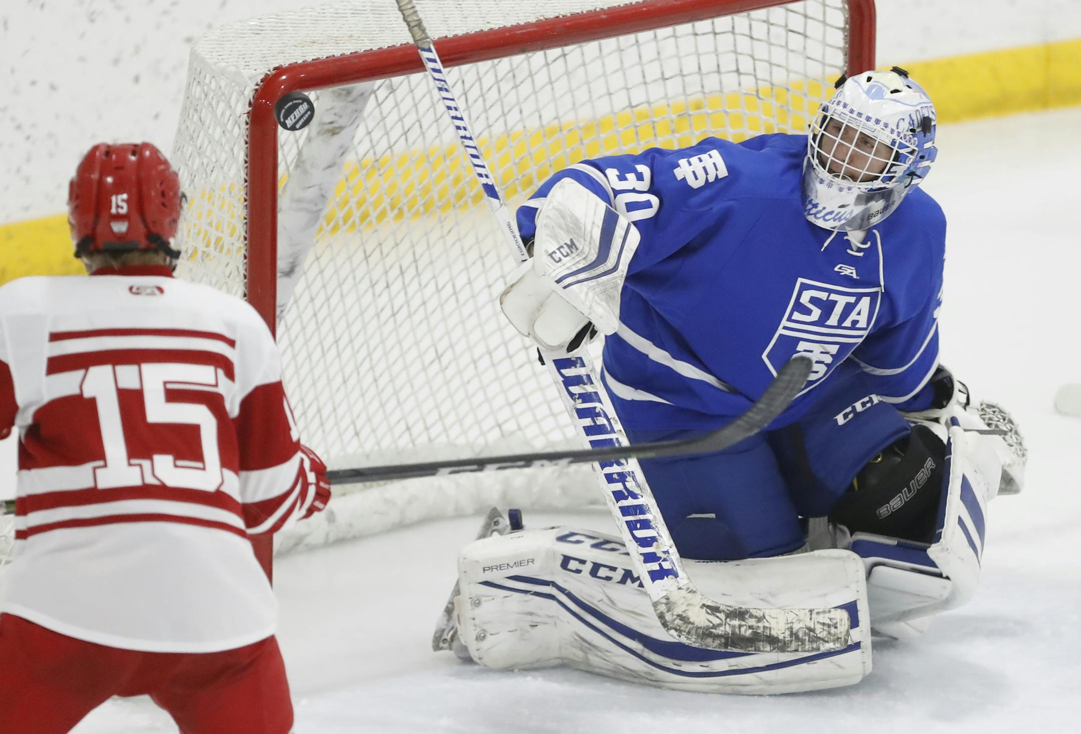 Goalie Atticus Kelly(30) sees a shot on goal hit the crossbar. ]St. Thomas Academy will be playing Benilde-St. Margaret's at the St. Louis Park Recreation Center Richard Tsong-Taatariiïrtsong-taatarii@startribune.com