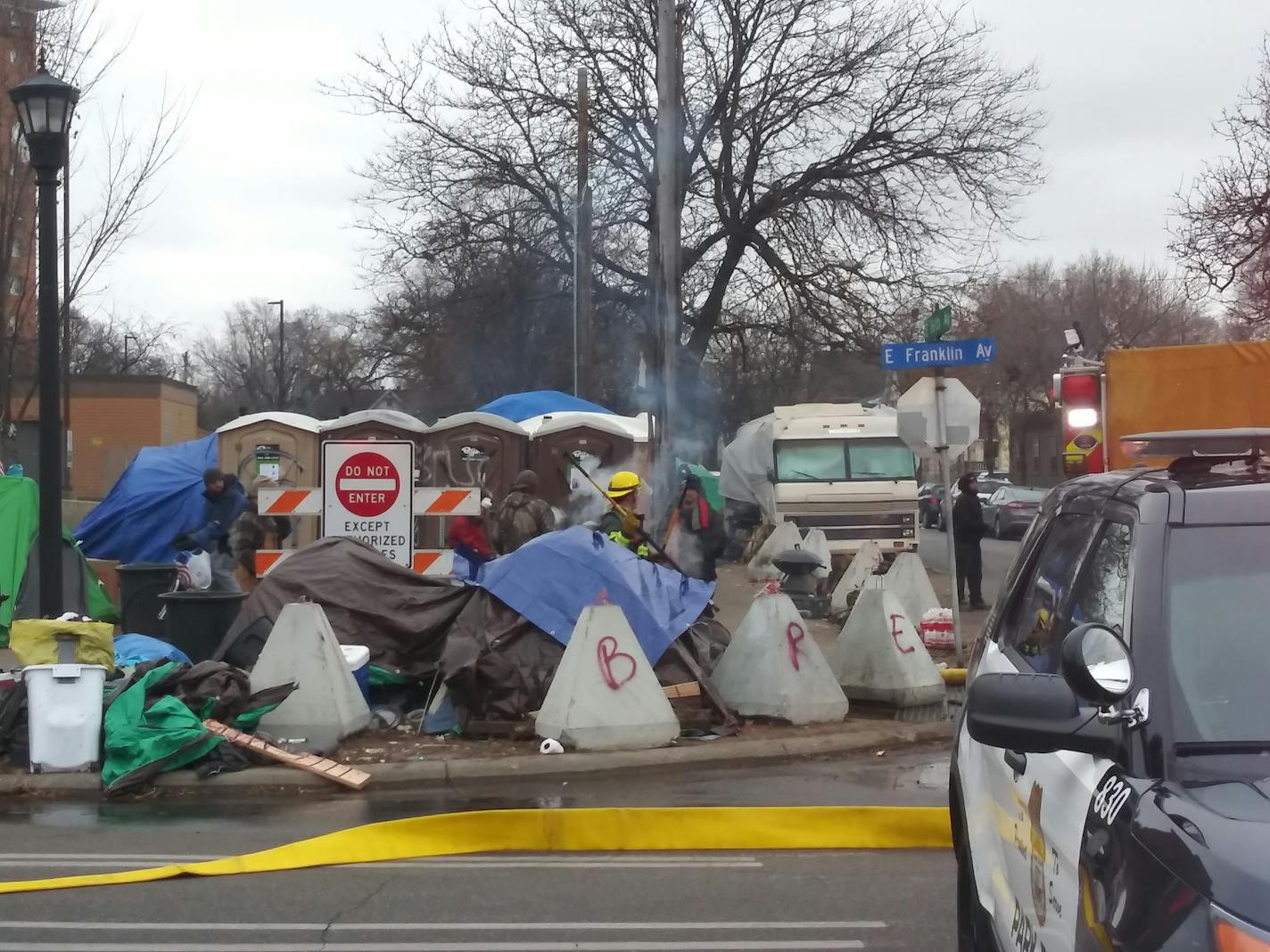 Minneapolis firefighters were on the scene at the tent encampment in Minneapolis.