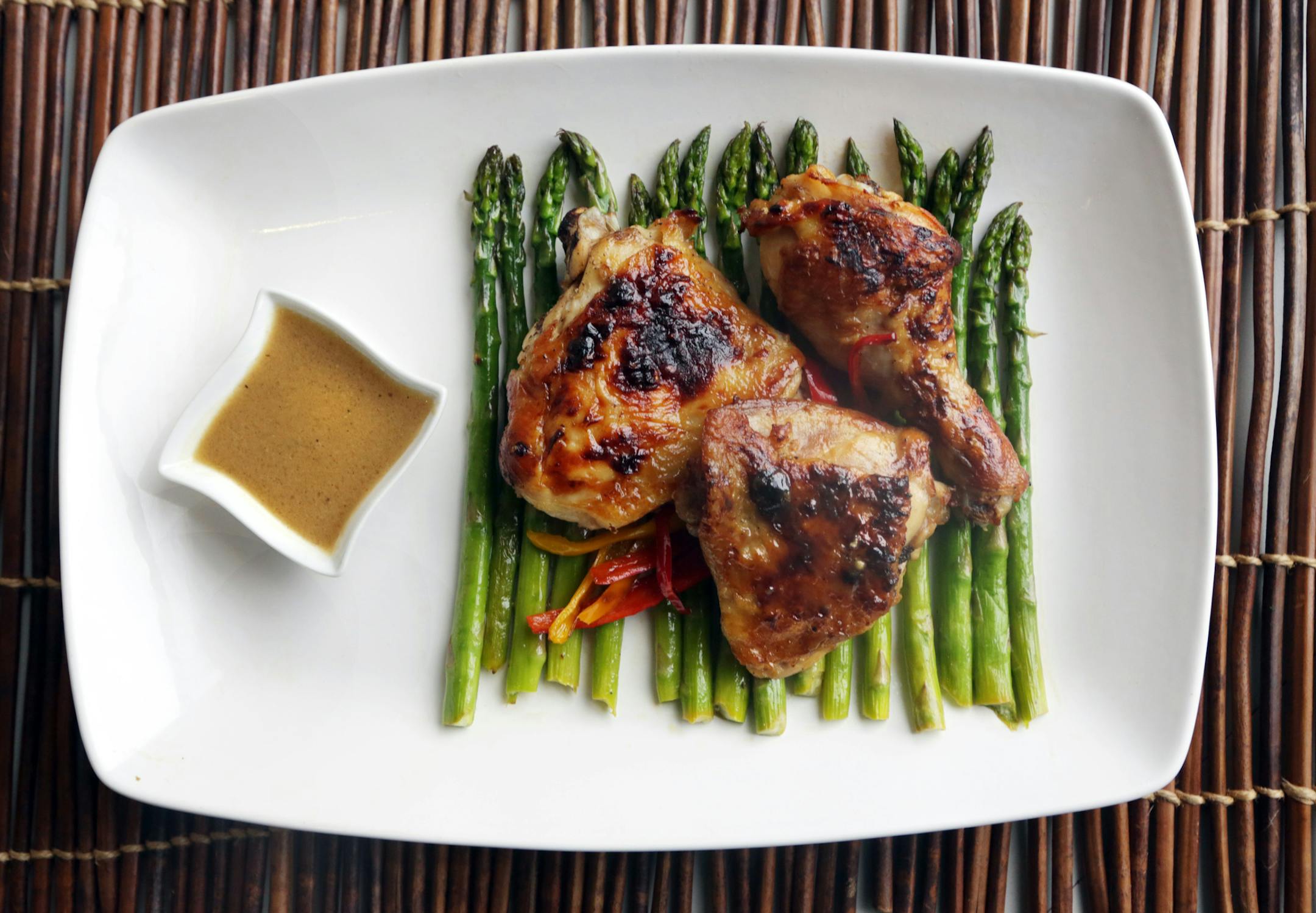 Fresh lemons, olive oil and Dijon mustard are paired with chicken, asparagus and sweet mini bell peppers in this dish. (Kathleen Galligan/Detroit Free Press/MCT) ORG XMIT: 1137707