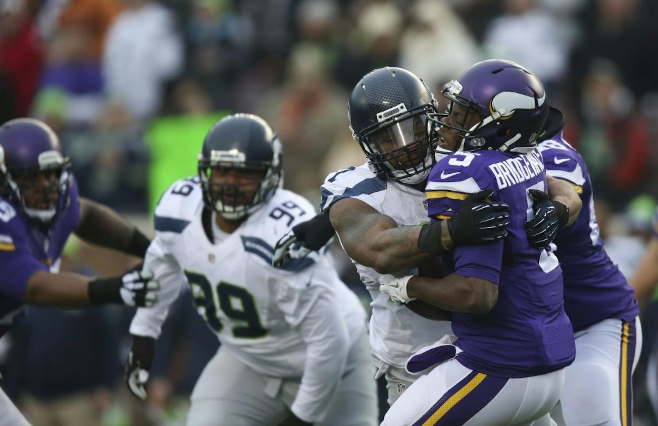 Vikings quarterback Teddy Bridgewater (5) was sacked hard by Seahawks defensive end Michael Bennett (72) for an 8-yard loss in the fourth quarter Sunday.