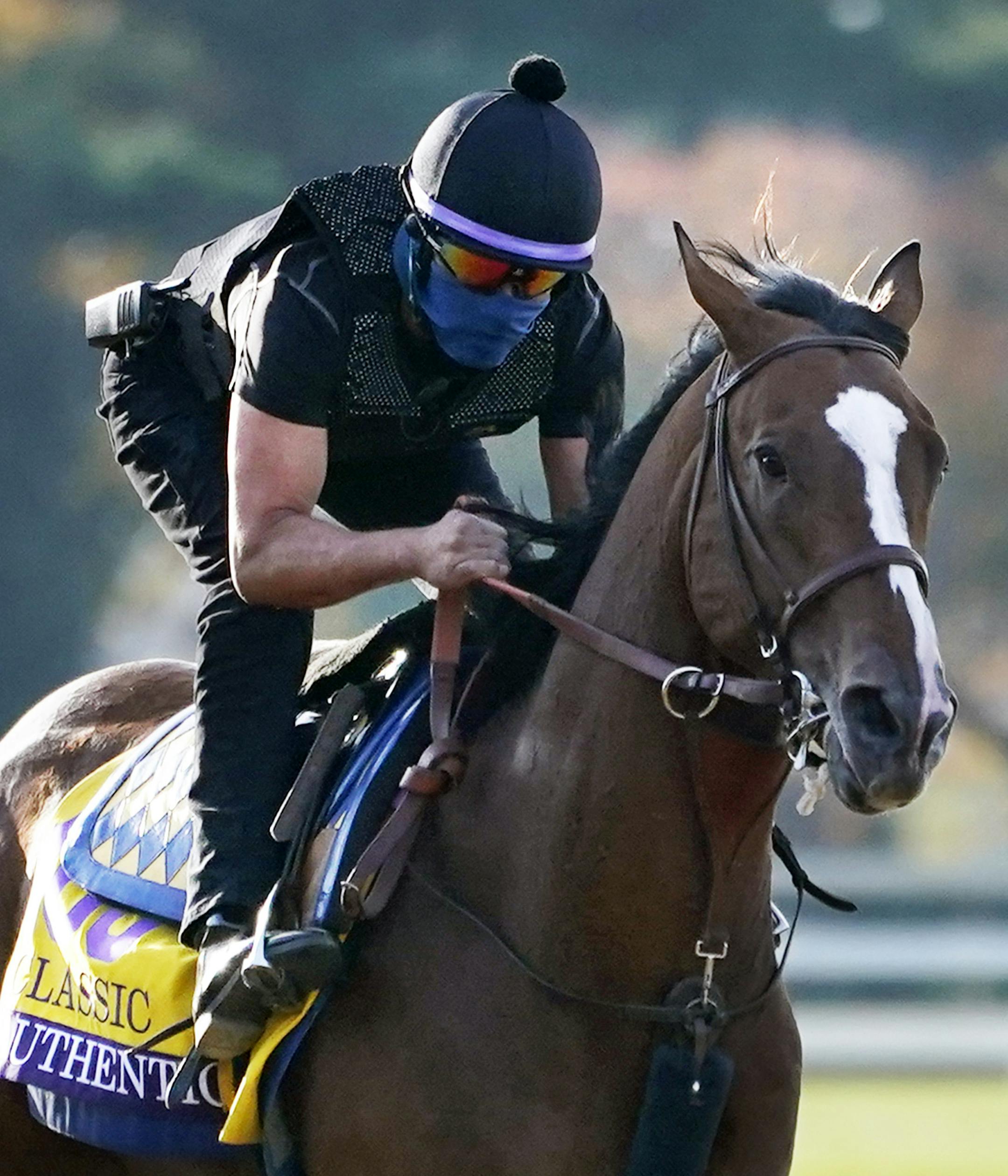 Kentucky Derby winner Authentic is taken for a workout at the Breeders' Cup World Championship horse races at Keeneland Race Course Thursday, Nov. 5, 2020, in Lexington, Ky. Authentic is scheduled to run in the Breeders' Cup Classic race Saturday. (AP Photo/Mark Humphrey)