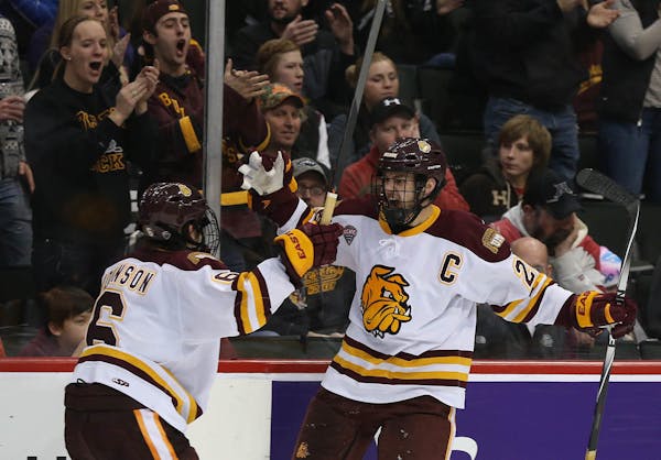 Bulldog Adam Krause celebrated his winning goal with teammate Derik Johnson during the third period. ] (KYNDELL HARKNESS/STAR TRIBUNE) kyndell.harknes