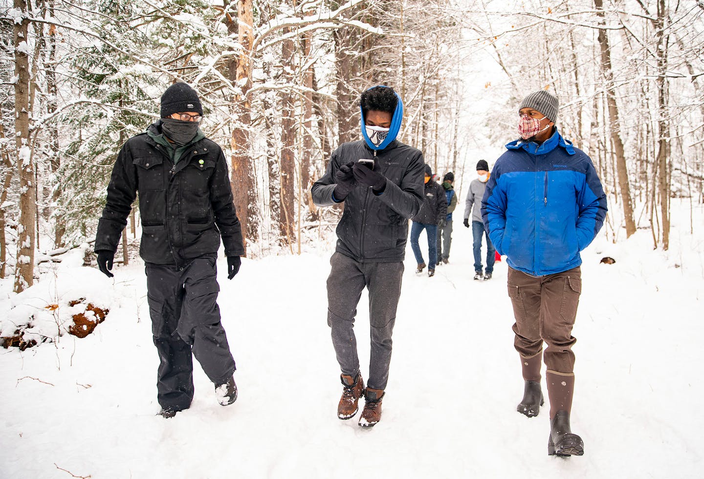 From left, Sumair Sheikh, Daniel Oyinloye and Dudley Edmondson took in time Nov. 15 together on the Bagley Nature Center trails in Duluth.