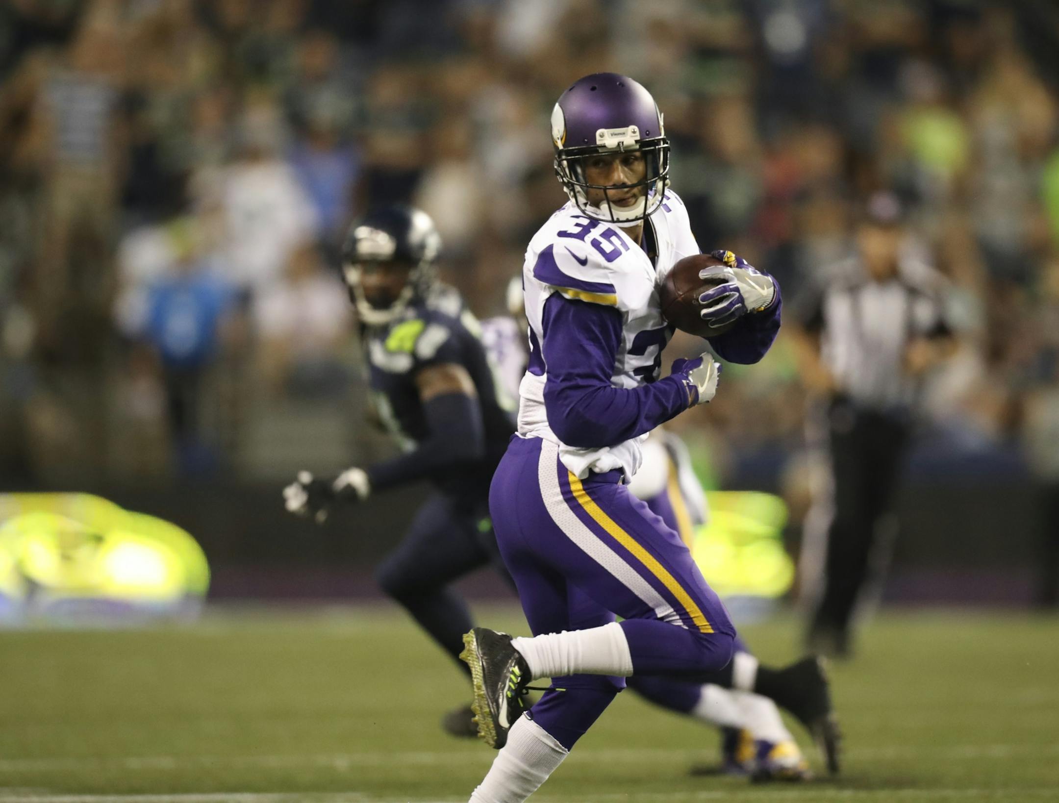 With the score tied, Vikings cornerback Marcus Sherels (35) intercepted a fourth quarter pass intended for Seattle's E.Z. Nwachukwu and returned it 53 yards for the game winning touchdown Thursday night.