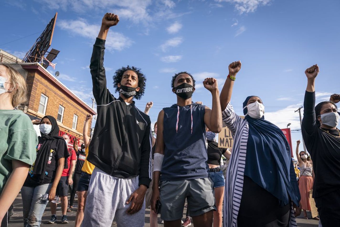 The crowd raised their fists to George Floyd outside of Cup Foods.