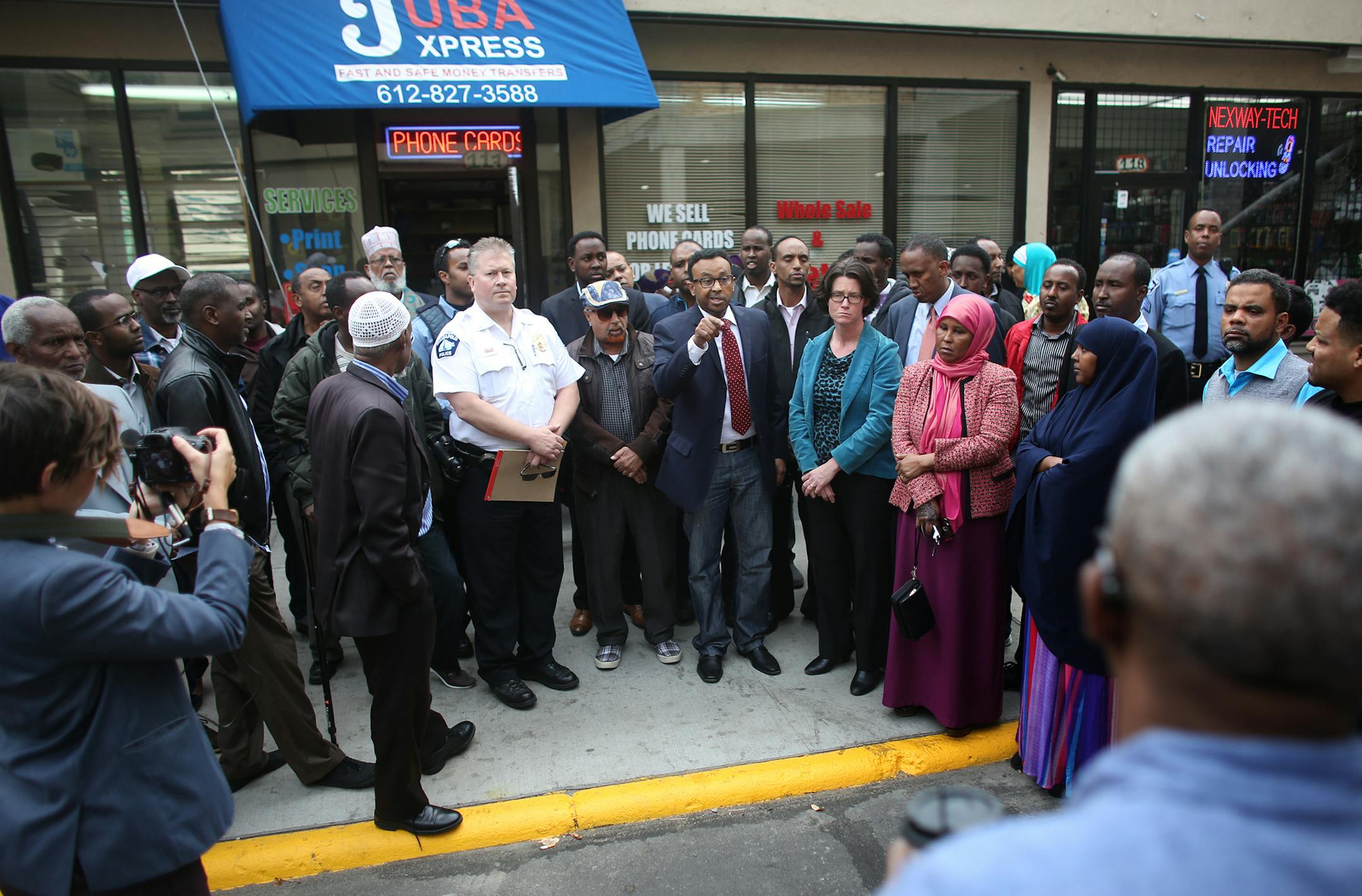 More than 100 people gathered to listen to and ask questions of Minneapolis police Inspector Todd Loining, of the Fifth Precinct, as the police and city came out Tuesday to show support and ask for help to find the shooter of Abdi Haji Mohamed Liiban.
