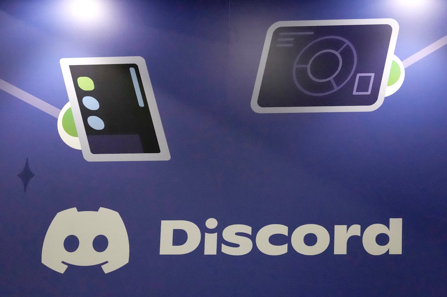 FILE - A display Discord stands at the company's booth at the Game Developers Conference 2023 in San Francisco on March 22, 2023. A major leak of classified U.S. documents that's shaken Washington and exposed new details of its intelligence gathering may have started in a chatroom on the social media platform popular with gamers. (AP Photo/Jeff Chiu, File)