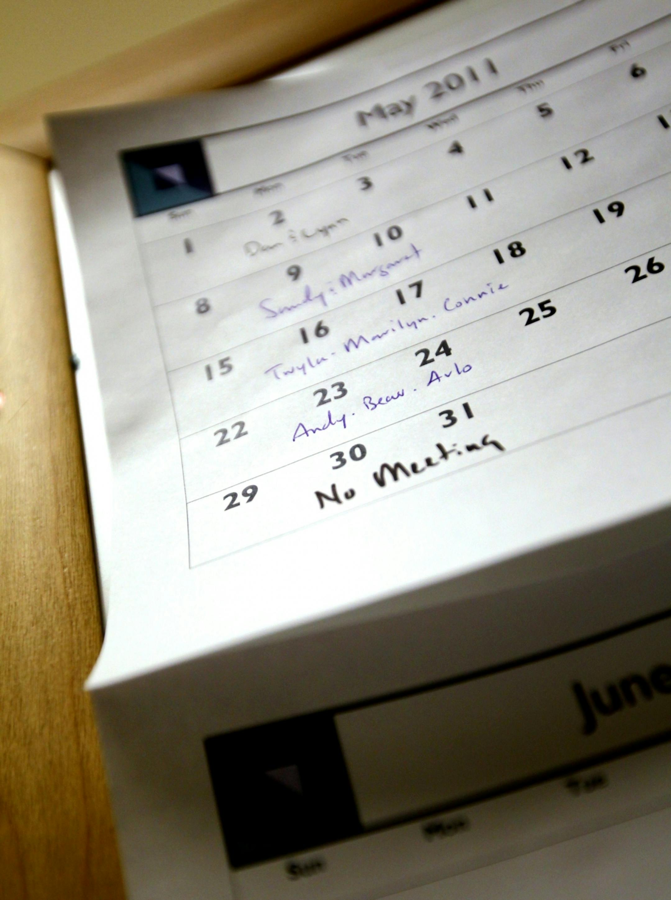 The "lunch bunch" calendar on the bulletin board at Roger Fazendin Realtors in Wayzata reminds employees when they're scheduled to make lunch for the office. Each Monday a group of two or three people provides the midday meal. Photographed May 23, 2011.