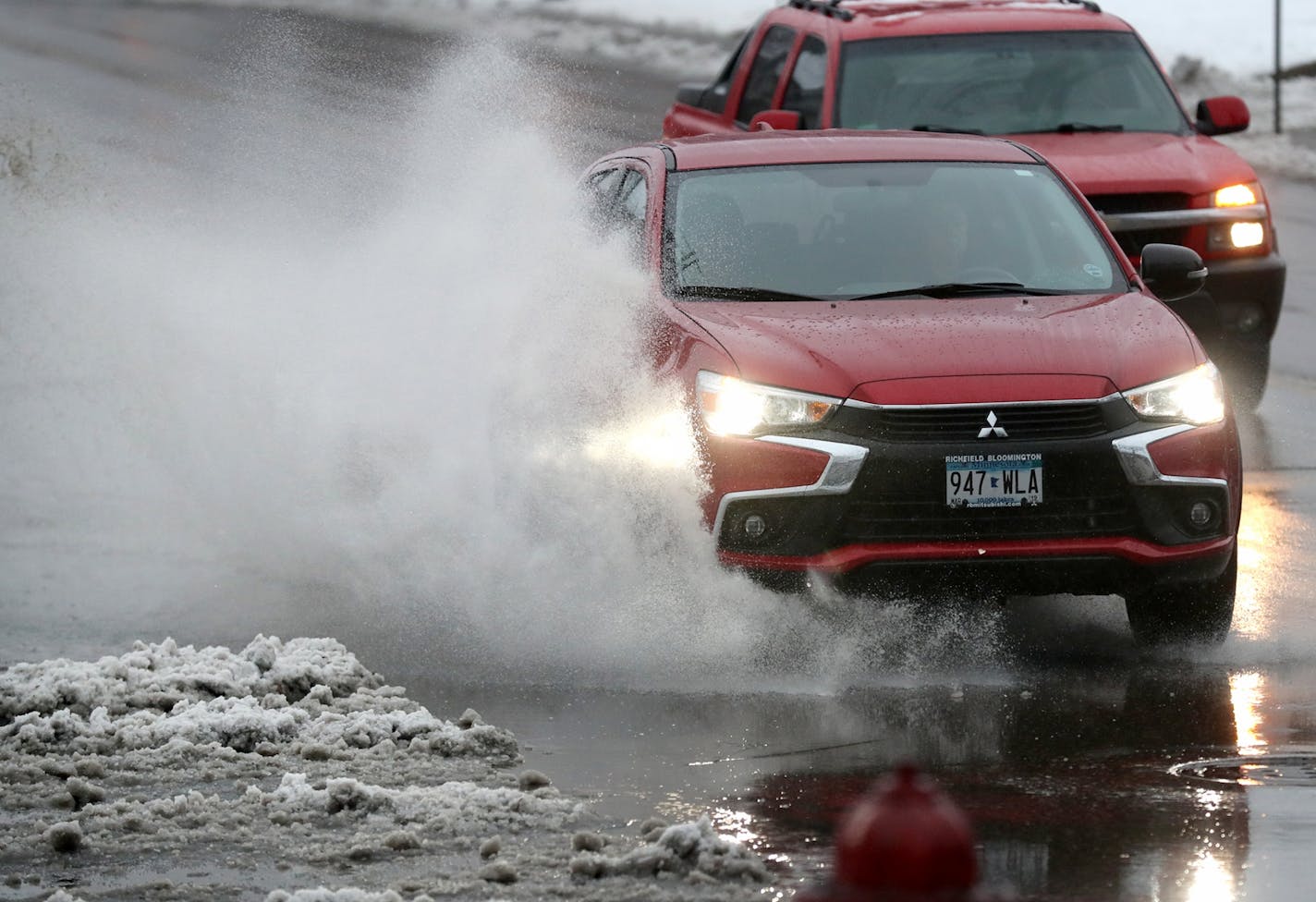 A winter storm brought wet snow and enough rain to make for slow going on Franklin Avenue in Minneapolis on Thursday.