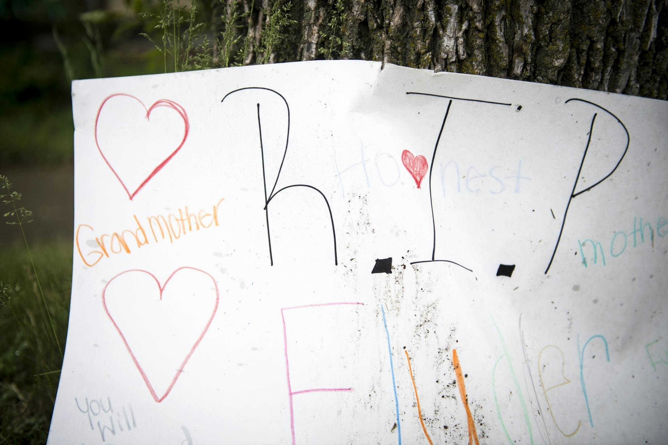 A memorial for Birdell Beatrice Beeks, 59, was placed against a tree near where she was shot and killed Thursday night at Penn Avenue North and North 21st Avenue in north Minneapolis.