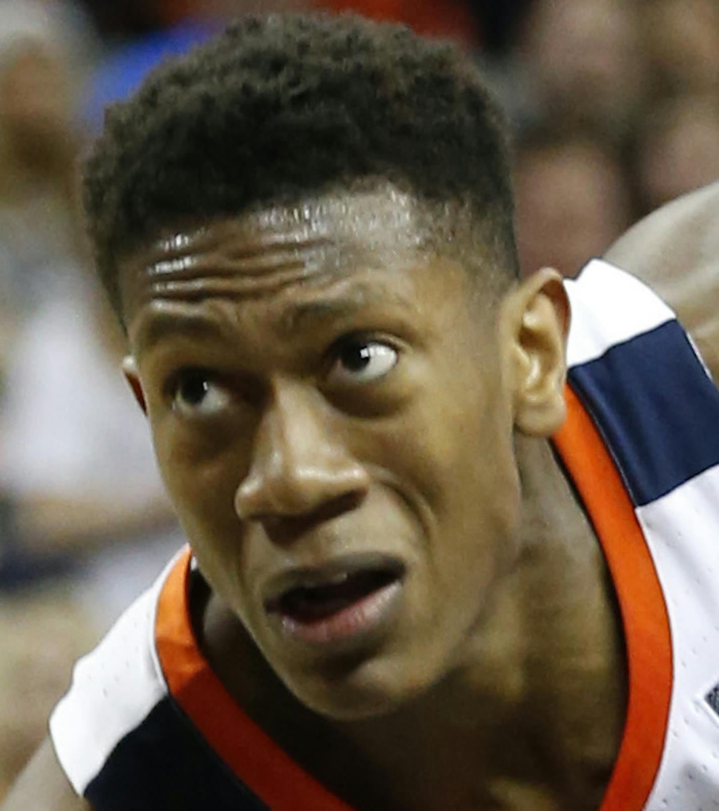 Virginia guard De'Andre Hunter (12) drives top the basket as he gets around Virginia Tech guard Isaiah Wilkins (1) during the first half of an NCAA college basketball game in Charlottesville, Va., Tuesday, Jan. 15, 2019. (AP Photo/Steve Helber)