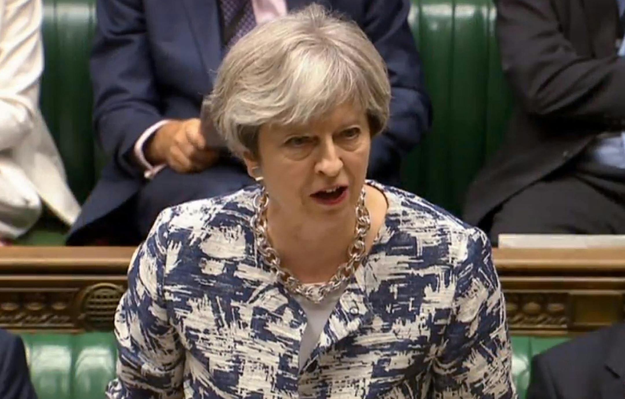 British Prime Minister Theresa May makes a statement on the European Council to members in the House of Commons, London, Monday June 26, 2017. Theresa May told Parliament Monday that steps will be taken to make sure the Brexit split with the EU is handled with care for the estimated 3 million EU citizens currently living inside Britain. (/PA via AP)