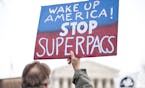 UNITED STATES &#x2013; JANUARY 20: Move to Amend holds a rally at the Supreme Court to "Occupy the Courts" and mark the second anniversary of the Citi