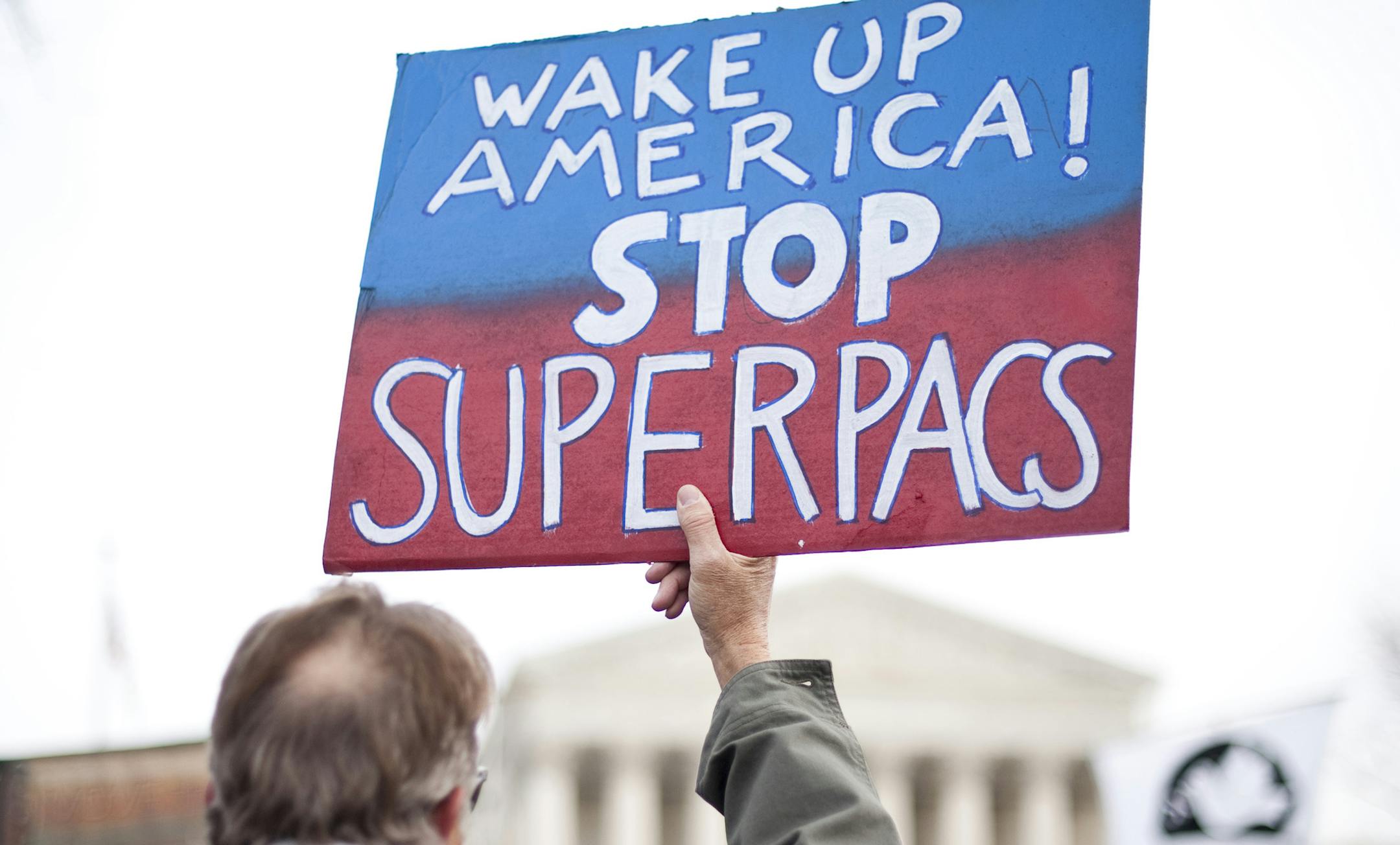 UNITED STATES – JANUARY 20: Move to Amend holds a rally at the Supreme Court to "Occupy the Courts" and mark the second anniversary of the Citizens United v. FEC Supreme Court case on Friday, Jan. 20. 2012. (Photo By Bill Clark/CQ Roll Call) (CQ Roll Call via AP Images)