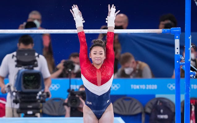 Suni Lee of the United States competes on the uneven bars during the women's team gymnastic's final at the delayed Tokyo 2020 Olympic Games in Tokyo o