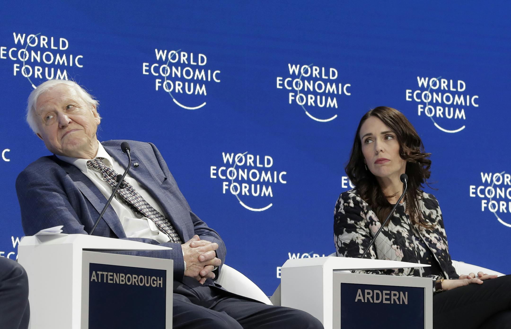 Sir David Attenborough, broadcaster and natural historian, and Jacinda Ardern, Prime Minister of New Zealand, participate in the "Safeguarding the planet" session at the annual meeting of the World Economic Forum in Davos, Switzerland, Tuesday, Jan. 22, 2019. (AP Photo/Markus Schreiber)