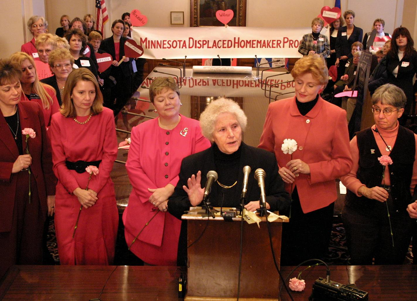 Rosalie Wahl is at the podium. -------- GENERAL INFORMATION: ST. PAUL, MN - WED - 2/14/2001 - Representative of Displaced Homemakers delivered a 415 foot long petition to Governor Ventura's office (the Reception Room) after parading it (in four parts) thru the capitol rotunda, following a meeting with speakers. IIN THIS PHOTO: At the podium, retired MN Supreme Court Justice Rosalie Wahl. Behind her, from left to right, Sen. Sandy Pappas, DFL-St. Paul; Sen. Ellen Anderson, DFL-St. Paul; Sen. Lind