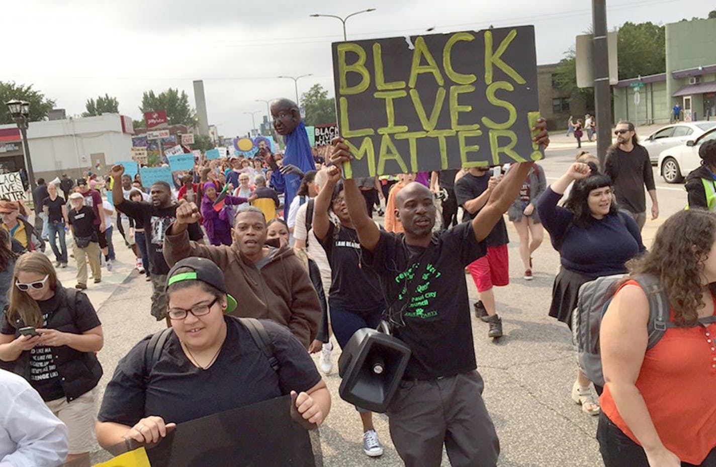 Black Lives Matter St Paul Marcher start walking towards the fair grounds from Hamline Park.