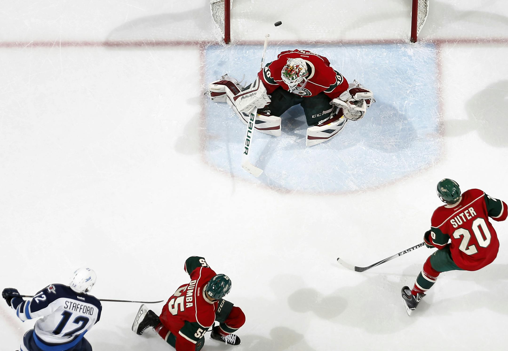 Drew Stafford (12) got the puck past Minnesota Wild goalie Devan Dubnyk (40) for a goal in the second period. ] CARLOS GONZALEZ cgonzalez@startribune.com, April 6, 2015, St. Paul, Minn., Xcel Energy Center, NHL, Minnesota Wild vs. Winnipeg Jets