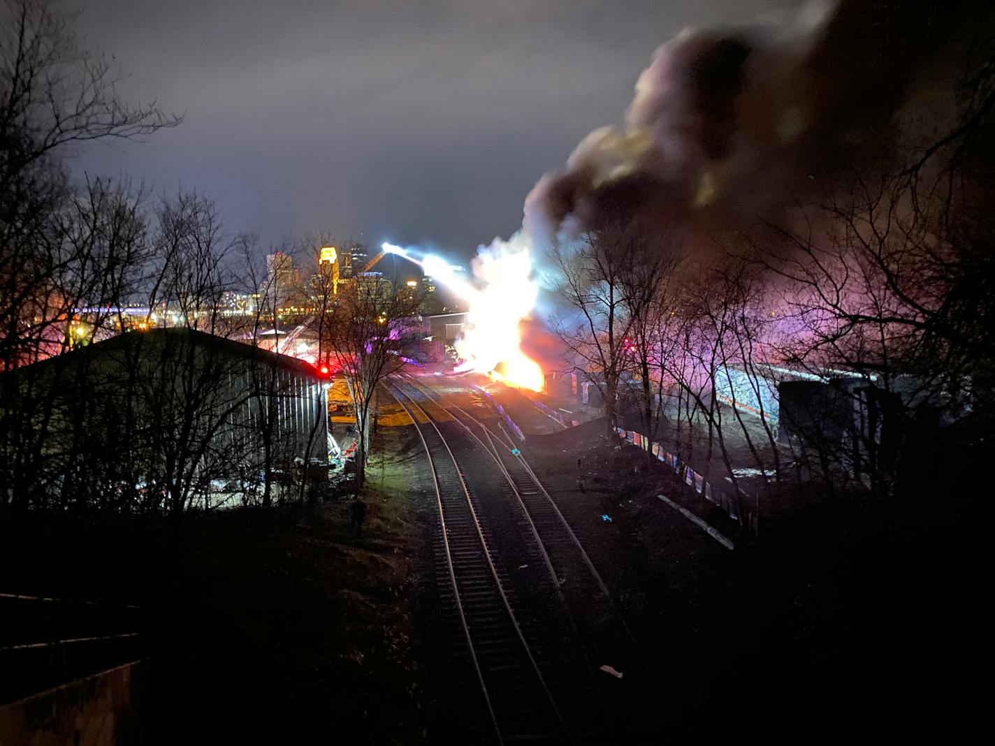 Minneapolis firefighters were battling a blaze in an industrial area west of downtown early Sunday.