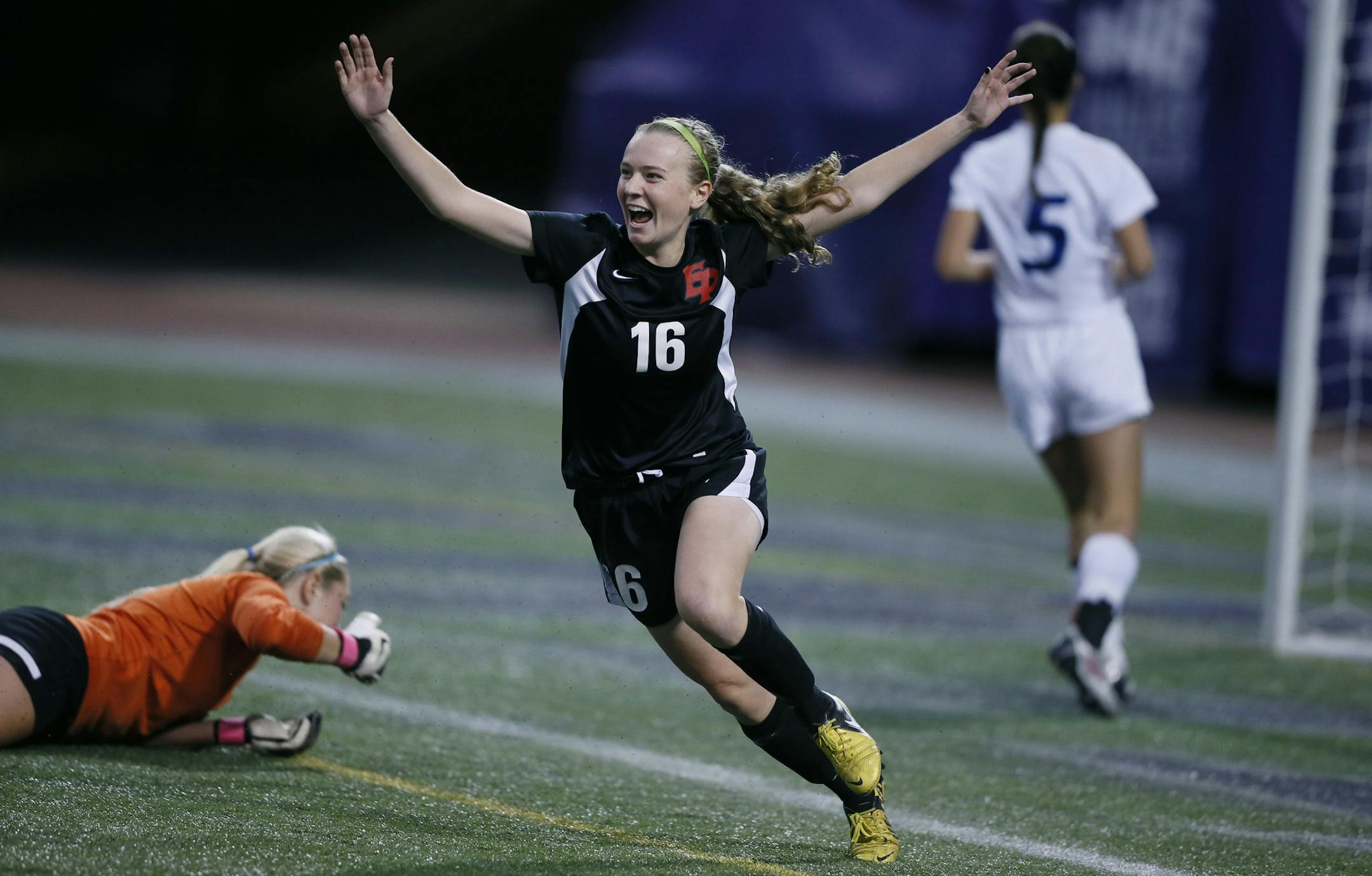 Eden Prairie's April Bockin reacted after scoring her 2nd goal of the game over Minnetonka's goal keeper Allison Haworth during class 2AA girls soccer action at the metro dome between Eden Prairie and Minnetonka Tuesday October 29, 2013 in Minneapolis, MN. Minnetonka beat Eden Prairie 3-2 in double overtime JERRY HOLT ‚Ä¢ jerry.holt@startribune.com