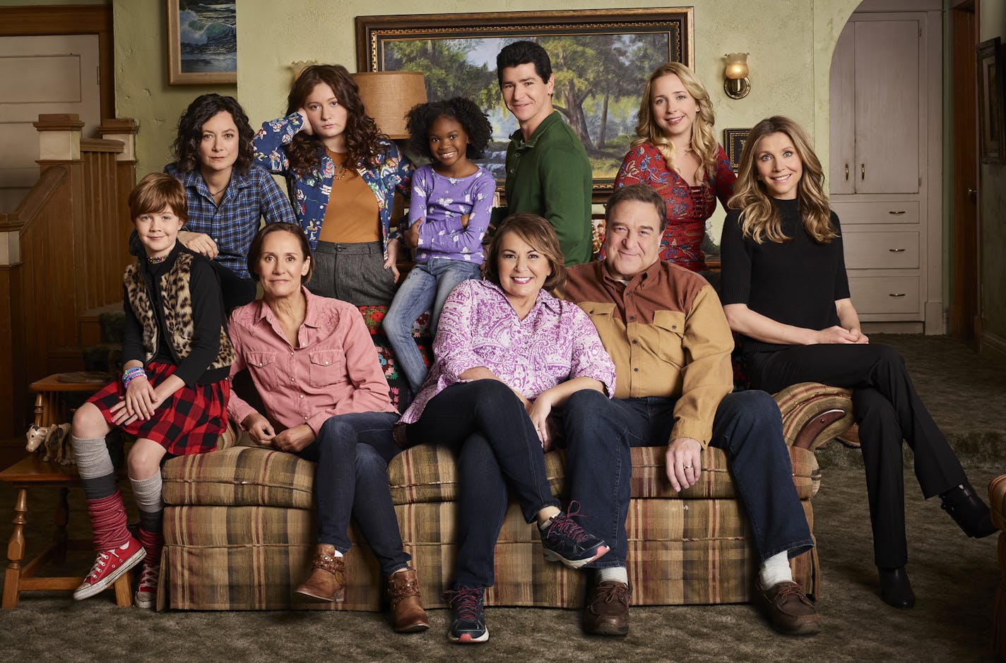 ROSEANNE - ABC's "Roseanne" stars Ames McNamara as Mark, Sara Gilbert as Darlene Conner, Laurie Metcalf as Jackie Harris, Emma Kenney as Harris Conner, Jayden Rey as Mary, Roseanne Barr as Roseanne Conner, Michael Fishman as D.J. Conner, John Goodman as Dan Conner, Lecy Goranson as Becky Conner, and Sarah Chalke as Andrea. (ABC/Robert Trachtenberg)