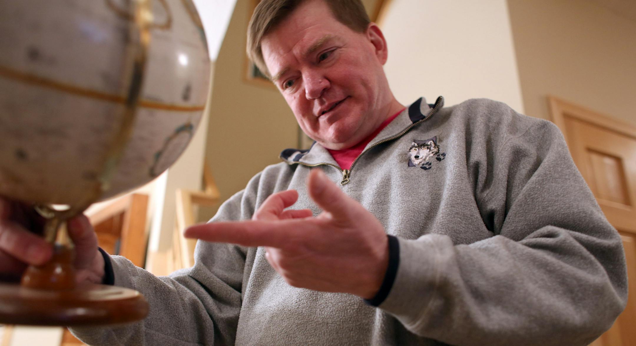 John Ebert talked about the challenges of making the map as accurate as he can and taking in consideration the curvature of the earth. ] (KYNDELL HARKNESS/STAR TRIBUNE) kyndell.harkness@startribune.com At the home of John Ebert in Brooklyn Park Tuesday, March 4 2014.