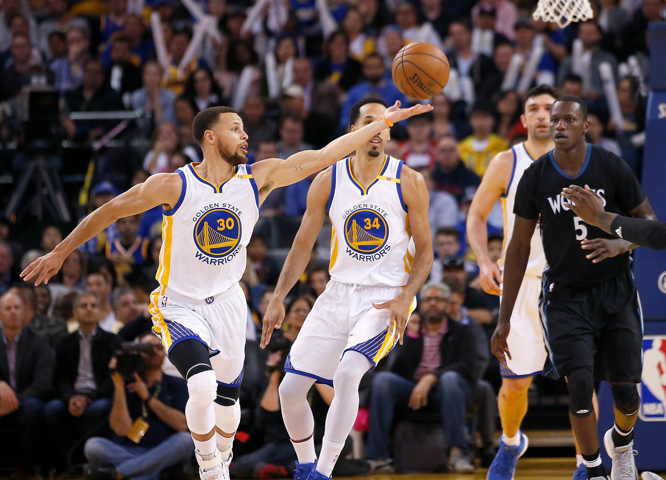 Golden State Warriors guard Stephen Curry (30) steals the ball from Minnesota Timberwolves forward Gorgui Dieng (5) during the second half of an NBA basketball game Tuesday, April 4, 2017, in Oakland, Calif. (AP Photo/Tony Avelar)