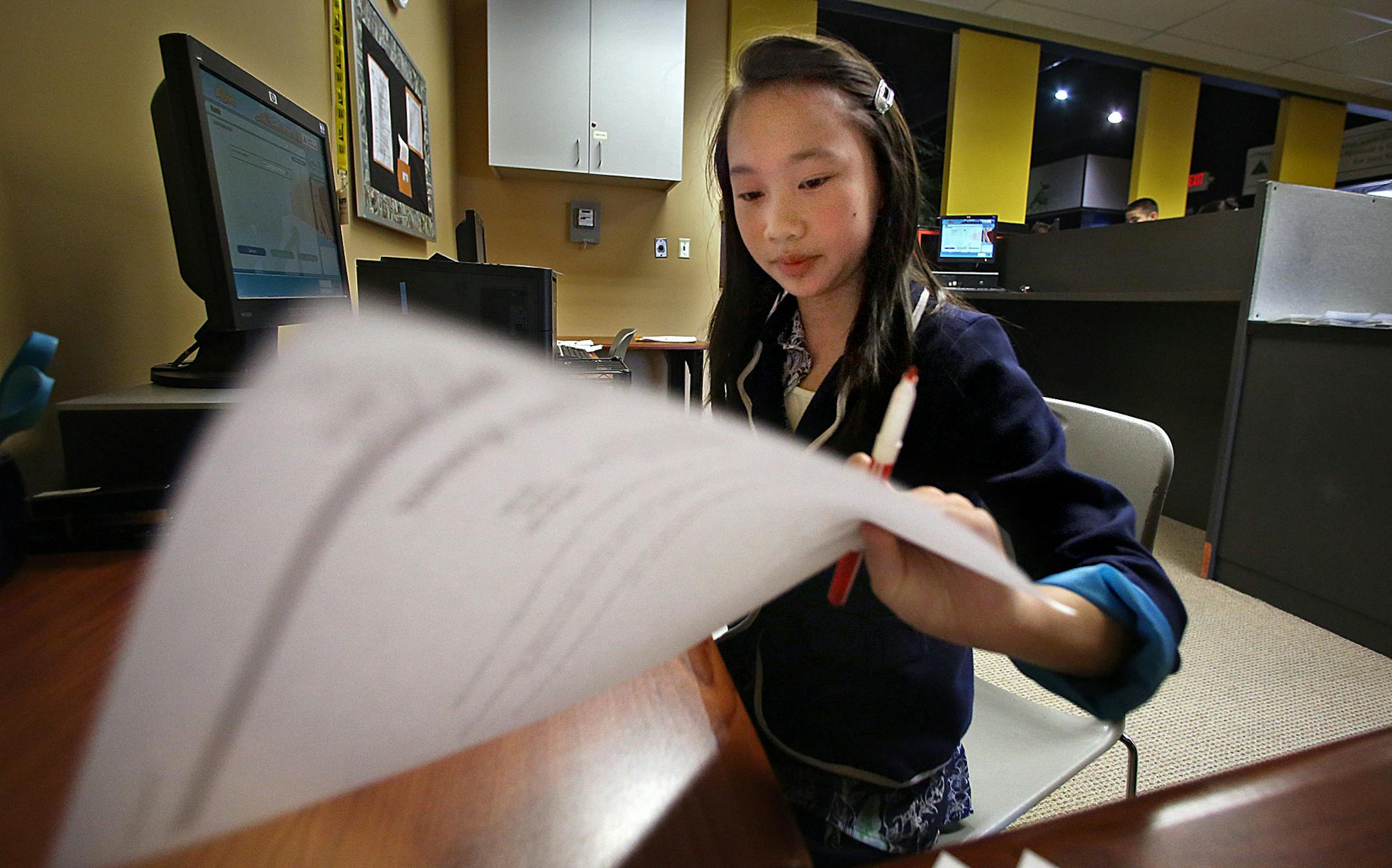 Greenleaf Elementary School student and bank CEO Nulia Nguyen, 10, examined documents. ] (JIM GEHRZ/STAR TRIBUNE) / April 2, 2013 / 11:00 AM Maplewood, MN ‚Äì BACKGROUND INFORMATION- Fourth and 5th grade Students from Greenleaf and Westview Elementary schools in the Rosemount-Apple Valley-Eagan School District spent a day recently learning how to run a business in a program put on by Junior Achievement. Students learned how to do payroll and taxes and pay utilities in a simulate