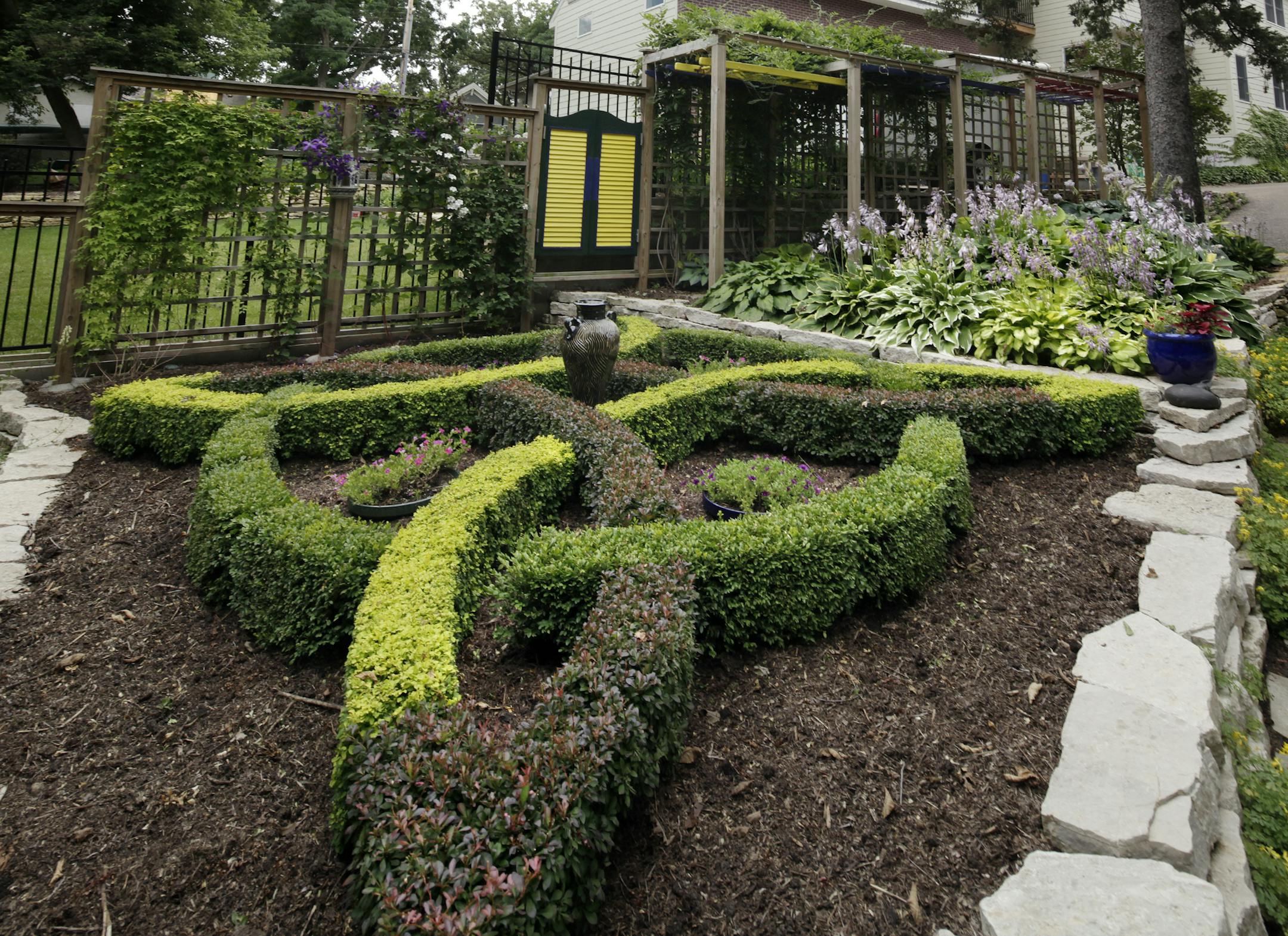 Beautiful Garden winners Barb and and Charlie Green have turned their Edina landscape into a series of gardens, including a knot garden, an iris garden, a shade garden and a labyrinthe in Edina, MN. August 2, 2013. ] JOELKOYAMA‚Ä¢joel koyama@startribune Beautiful Gardens winners Barb and and Charlie Green have turned their Edina landscape into a series of gardens, including a knot garden, an iris garden, a shade garden and a labyrinthe.