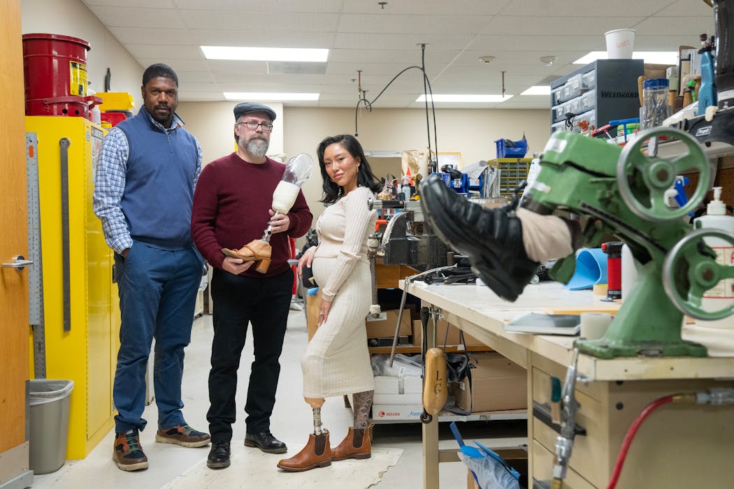 From left, Juan Cave, a prosthetist-orthotist, Eric Nickel, a biomedical engineer, and Kelly Yun, a prosthetic technician and designer, are launching a study at the Minneapolis VA Medical Center to see if veterans gain psychological and social benefits from using a modular prosthetic leg that allows them to easily change out shoe styles.