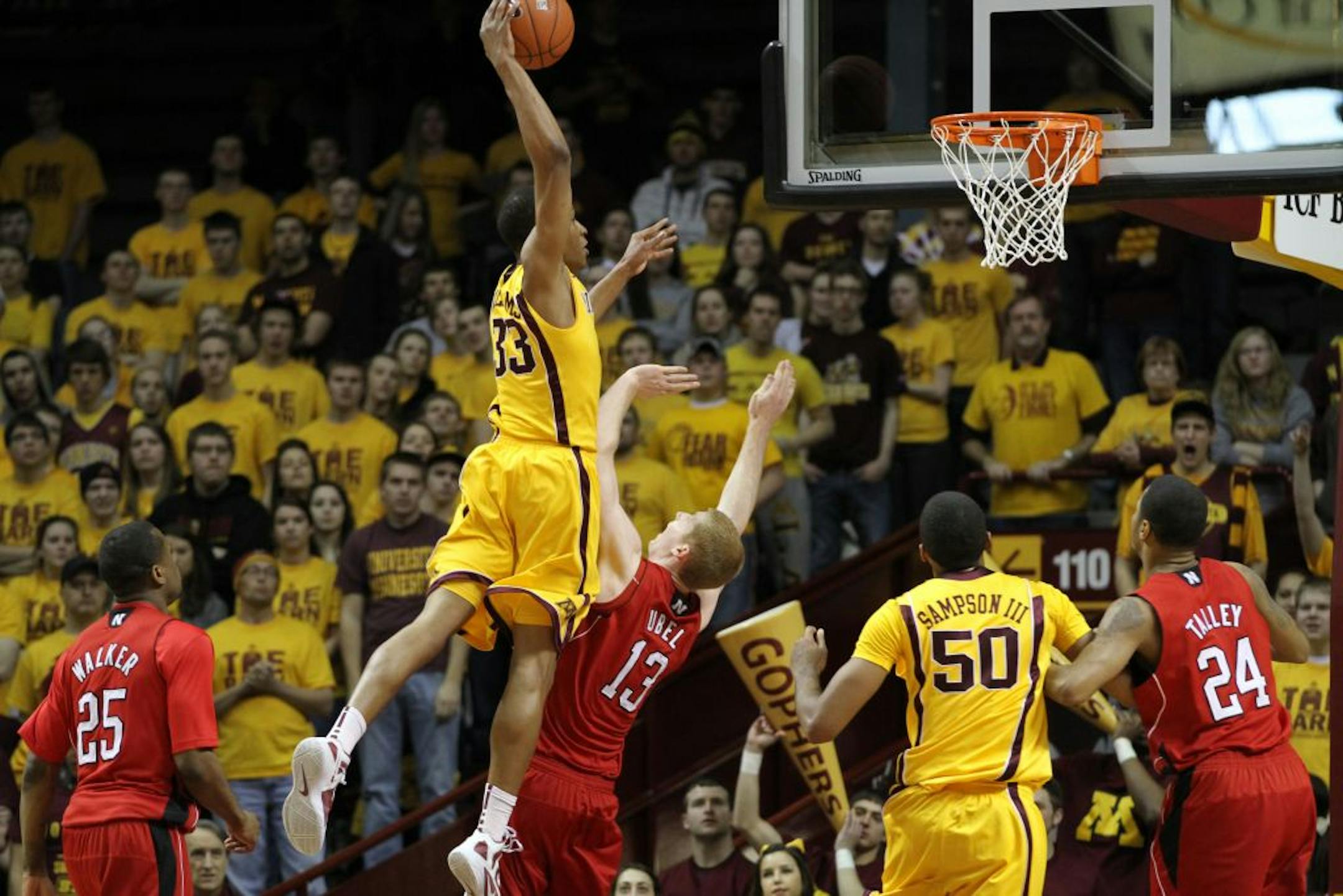 Minnesota's Rodney Williams went to the air and jammed the basket homeover Nebraska's Brandon Ubel.