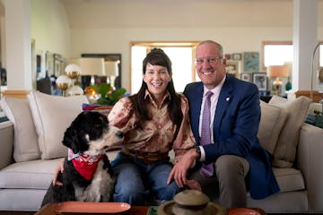College of St. Benedict and St. John's University president Brian Bruess and his wife, Carol, with their dog, George, at the president’s residence o